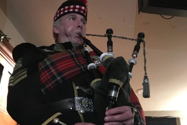 Scottish piper at the Albion