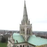 A wide angle shot of Chichester Cathedral with the steeplejacks, two little dots on the spire in 2011