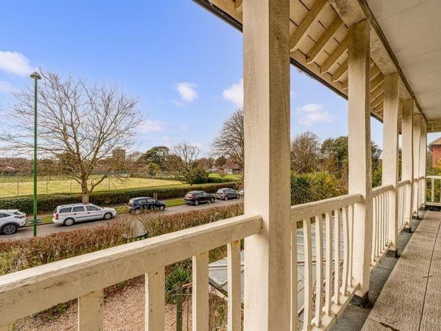 The south-facing balcony offers stunning views overlooking tennis courts