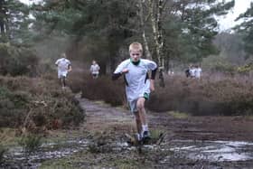 The runners faced plenty of mud and standing water on the tough cross-country course