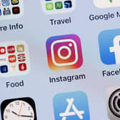 The Instagram app on the screen of an iPhone - and Brighton's following on the site is rocketing, along with some other Premier League clubs' numbers (Photo Illustration by Justin Sullivan/Getty Images)