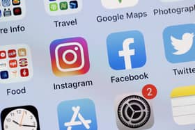 The Instagram app on the screen of an iPhone - and Brighton's following on the site is rocketing, along with some other Premier League clubs' numbers (Photo Illustration by Justin Sullivan/Getty Images)