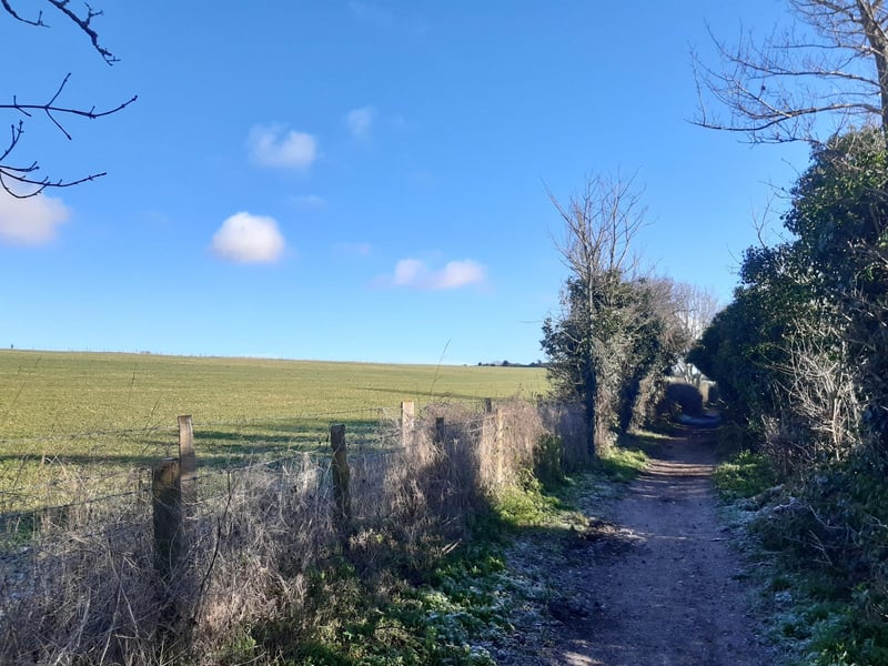 We are continuing straight on along the footpath, with Highdown Hill sweeping up on your left.