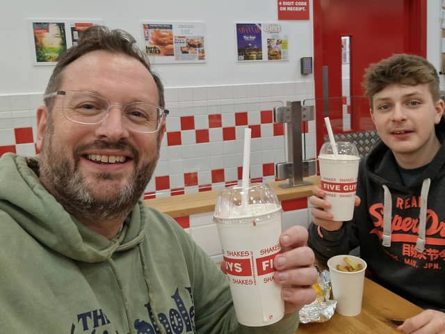 Sussex World's Mark Dunford and son Noah try out the new milkshake flavours at Five Guys | Picture: Sussex World