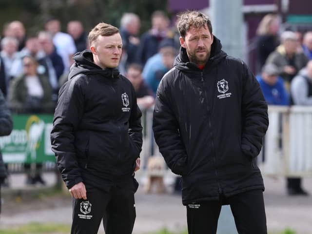 Ben Cornelius and Chris Agutter watch their Hastings team take on Enfield | Picture: Scott White
