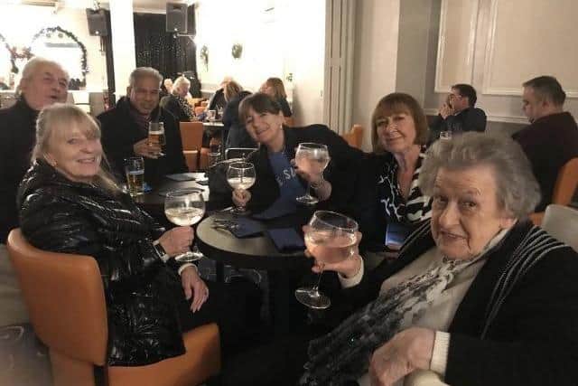 Sylvia Holmes (blond with black coat) with her friends at the tribute weekend - all wearing coats because it was cold in the entertainment area