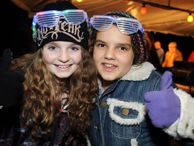 Cuckfield Bonfire Night 2010. Lily Hollings and Katy Jaques sell illuminating glasses