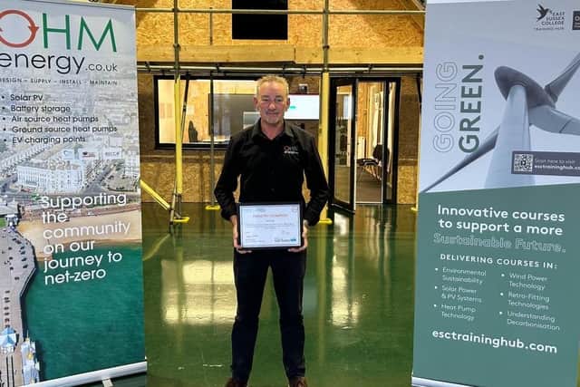 Paul Vine, Director at OHM Energy holding the OHM Energy Industry Champion certificate