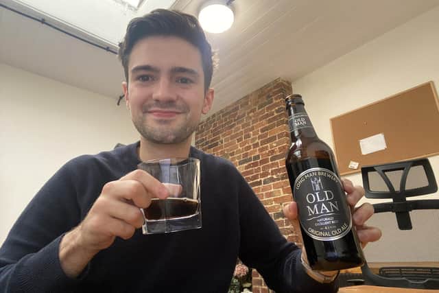 SussexWorld reporter Jacob Panons with the Old Man ale from Long Man Brewery