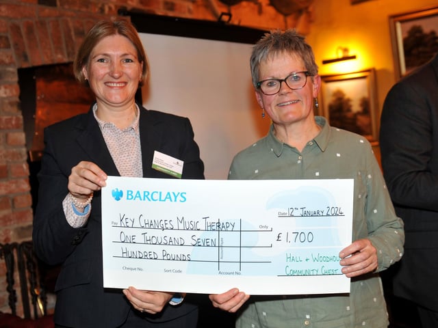 Judge Susie Rees presents a cheque for £1,700 to Key Changes Music Therapy