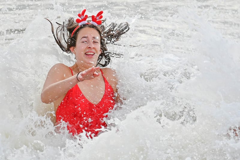 Around 100 bathers took a cold dip in the sea at Brighton on Christmas Day 2022
