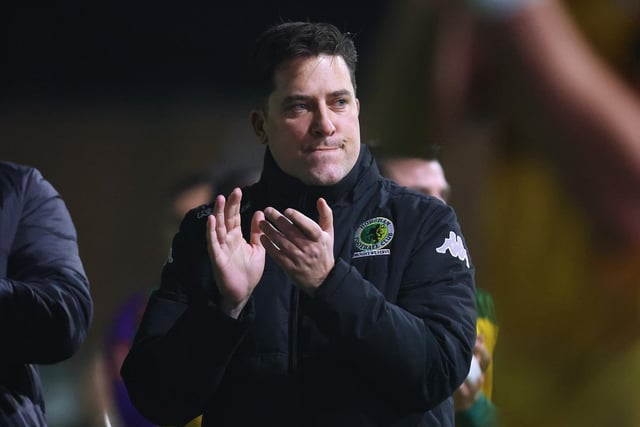 Dominic Di Paola, Manager of Horham, acknowledges the fans following the Emirates FA Cup First Round Replay match between Horsham and Barnsley at The Camping World Community Stadium.