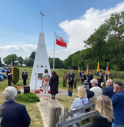Crowds gather at the Polish Airmen’s memorial at Plumpton on Sunday.