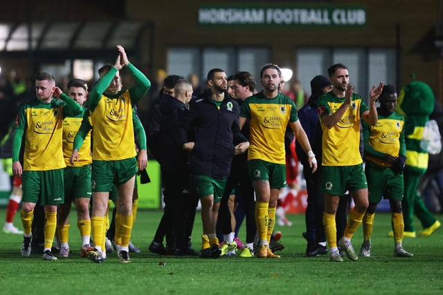 Horsham players acknowledge the fans following the Emirates FA Cup First Round Replay match between Horsham and Barnsley at The Camping World Community Stadium.