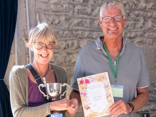 Chairman Chris Hill with Christina Goodwyn, who won the Silver Salver for mixed produce and John Rankin Dahlia Cup for dahlias grown by a resident of East Preston or Kingston