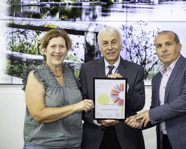 South & South East In Bloom judge Nick Hagon, centre, presents the Gold Award to Lancing Parish Council chair Denyse Whillier and clerk and chief executive Steven Trice at RHS Wisley. Picture: Ciaran McCrickard Photography