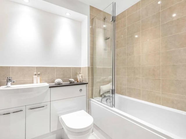 The family bathroom has a bathtub featuring a shower head