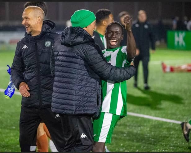 Scorer Mo Jammeh celebrates with manager Miles Rutherford and coach Darin Killpartrick | Picture: Neil Holmes