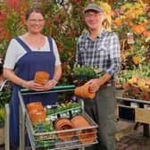 Clive Gravett at South Downs Nurseries handing over the plants and pots to Emma Evans from 