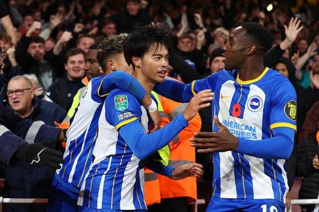 Kaoru Mitoma of Brighton & Hove Albion celebrates with teammates after scoring their team's second goal during the Carabao Cup Third Round match at Arsenal