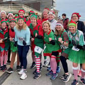 Olympic champion Sally Gunnell with elves on the start line