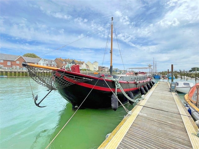 This stunning seafaring Dutch barge houseboat on a private mooring on the River Arun has come on the market with Michael Jones Estate Agents with a guide price of £275,000