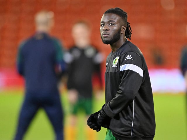 Daniel Ajakaiye of Horsham pre-match warm up ahead of the Emirates FA Cup First Round match between Barnsley and Horsham at Oakwell Stadium.