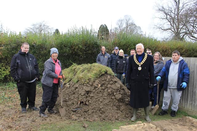 The Aldingbourne Trust group, with Horsham District Council chairman David Skipp and members of the council's parks and countryside team alongside the hibernaculum