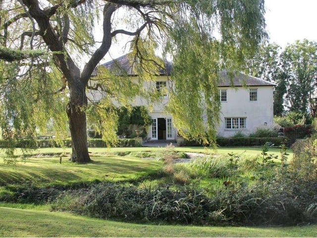 There are two principal areas of formal grounds: to the east of the house is a part-walled garden with a central weeping willow, encircled by a charming pond lined with irises