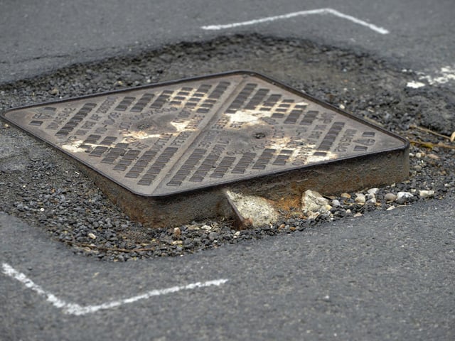 Potholes in Jevington Road, Polegate (Photo by Jon Rigby)