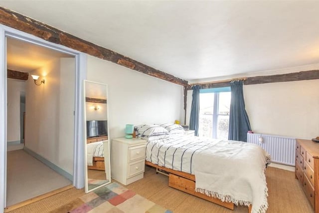 Two staircases connect the first floor accommodation. The staircase from the dining room up to the double aspect study/ bedroom with medieval vaulted ceiling, Oak wood floor. The principal bedroom has a sash window, feature fireplace with cast iron grate and surround, built-in wardrobe.