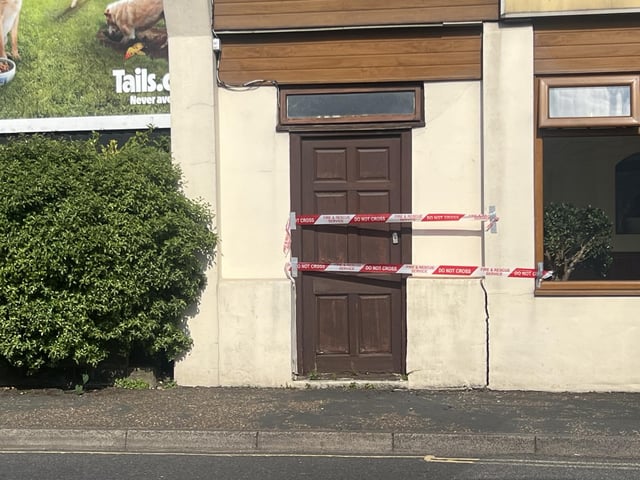 Two people taken to hospital after car collides with building in West Sussex