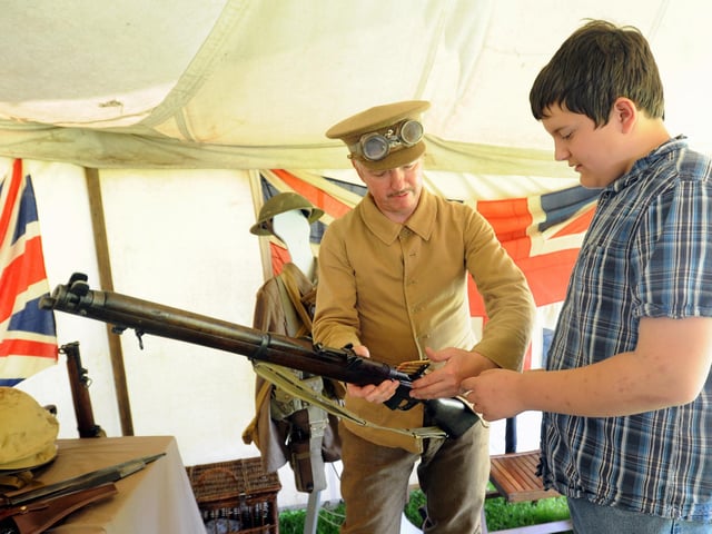 Peter Birkett of the Battlefield Partnership shows Ben Woodburn the equipment used in the First World War