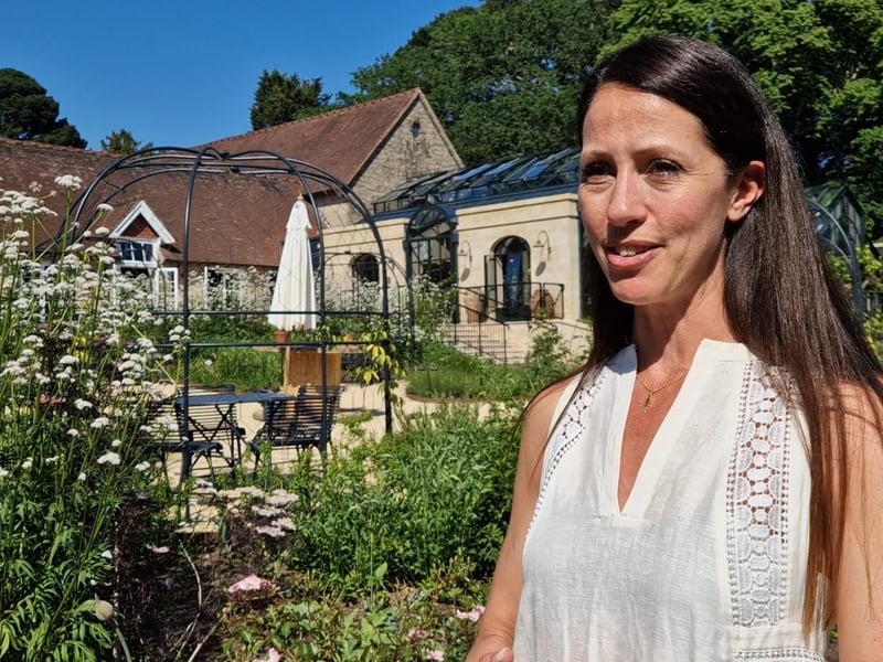 Fifth-generation custodian Jay Goddard (née Stephenson Clarke) in the garden.