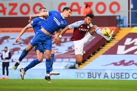 BIRMINGHAM, ENGLAND - NOVEMBER 21: Tyrone Mings of Aston Villa controls the ball under pressure from Lewis Dunk of Brighton and Hove Albion during the Premier League match between Aston Villa and Brighton & Hove Albion at Villa Park on November 21, 2020 in Birmingham, England. Sporting stadiums around the UK remain under strict restrictions due to the Coronavirus Pandemic as Government social distancing laws prohibit fans inside venues resulting in games being played behind closed doors. (Photo by Laurence Griffiths/Getty Images)