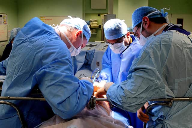 EMBARGOED TO 0001 MONDAY FEBRUARY 4 File photo dated 7/4/11 of an operation taking place. An extra 290,000 operations could be carried out on the NHS every year if the way theatre lists are managed was improved, a national review has found.