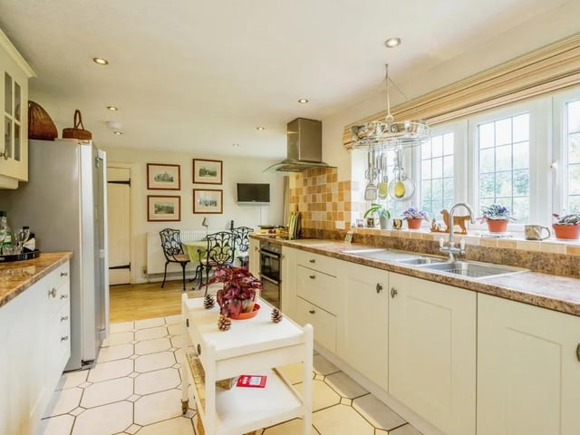 The kitchen combines modern convenience with old-world character.