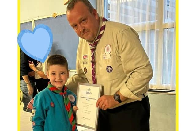 Ian Buckman presents Commissioner's Commendation Award to brave  Harry 