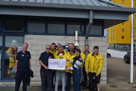 Eastbourne’s RNLI was presented with a cheque of £2,000 by a member of the public who wing walked in aid of the charity. Picture: RNLI