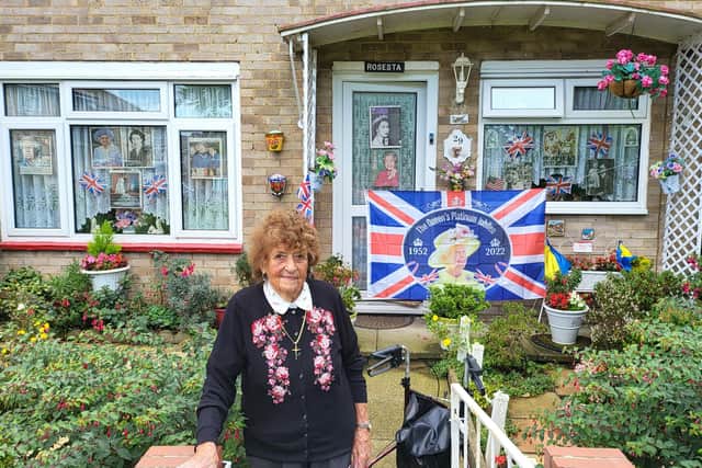 Betty Phillips outside her house in Gossops Green