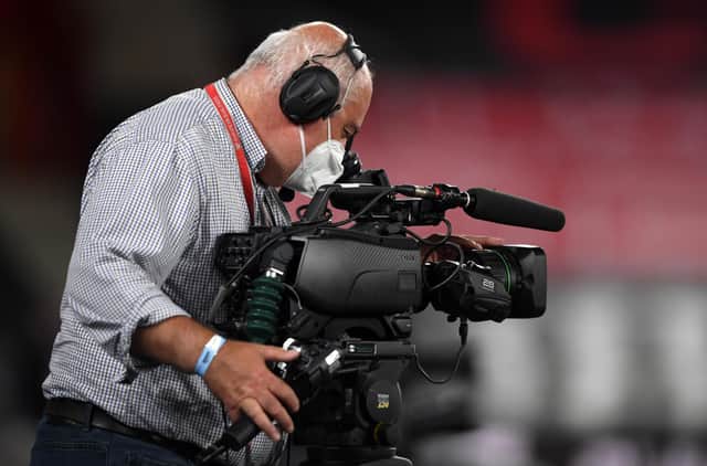 A TV cameraman at work during the Premier League match between Southampton FC and Brighton & Hove Albion at St Mary's Stadium.
