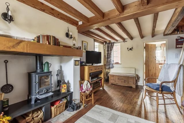 The accommodation on the ground floor consists of a sitting room with attractive fireplace and log burner, a kitchen/dining room, study/ground floor bedroom and cloakroom.