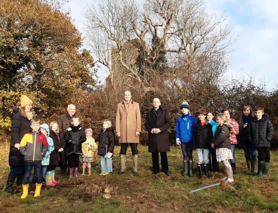 QGC tree planting at Laughton with children from Laughton Primary School, Headteacher Rachel West, Revd Geoffrey Smith, the Lord-Lieutenant and the Bishop of Chichester