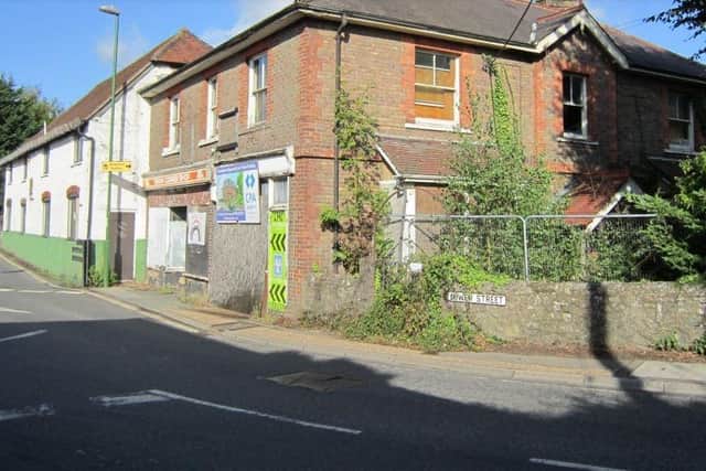 A drunk driver crashed into the building in a conservation area in Pulborough in July and now developers say demolition is 'urgently' needed