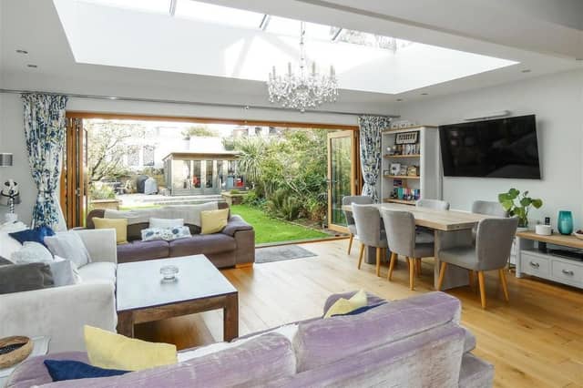 The outstanding family room encompasses a stylish open-plan kitchen, feature roof lantern and bifold doors