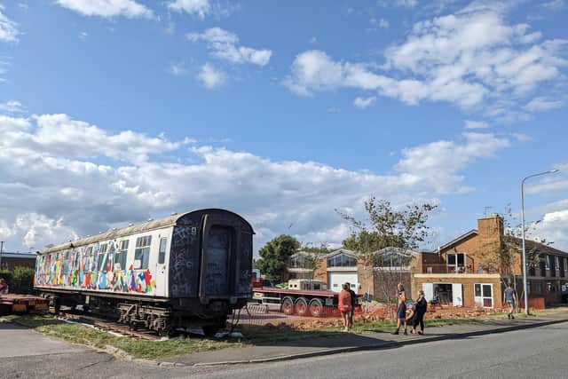 The 1960s train carriage arriving at Old Ambulance Station, Bexhill. Picture by Mel Hickford