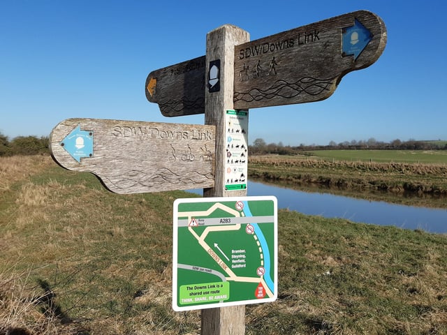 Please be aware we are now going to be on a shared used route that is popular with cyclists but it is still largely flat and wide enough for pushchairs. We are following the sign pointing to the left in this photo.