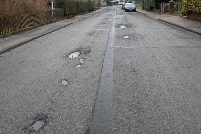 Potholes in Orchard Road, Horsham. Photo: Kathryn Craig