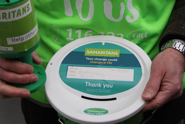 Samaritans fundraising volunteer with a collection bucket