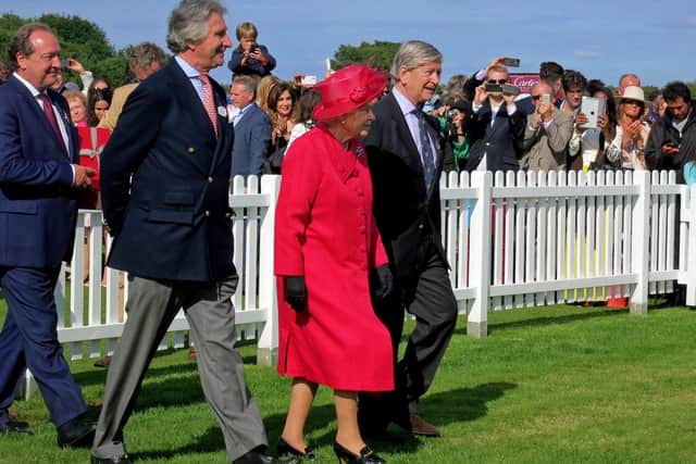 The Queen wearing a pair of Cornelia James gloves at an event